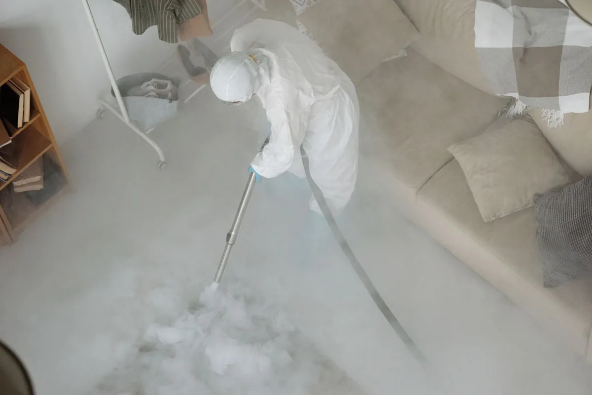 Biohazard cleanup technician in protective equipment, Ingram, PA